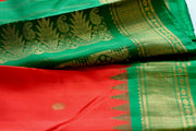 Gadwal silk fire orange wtih green temple border